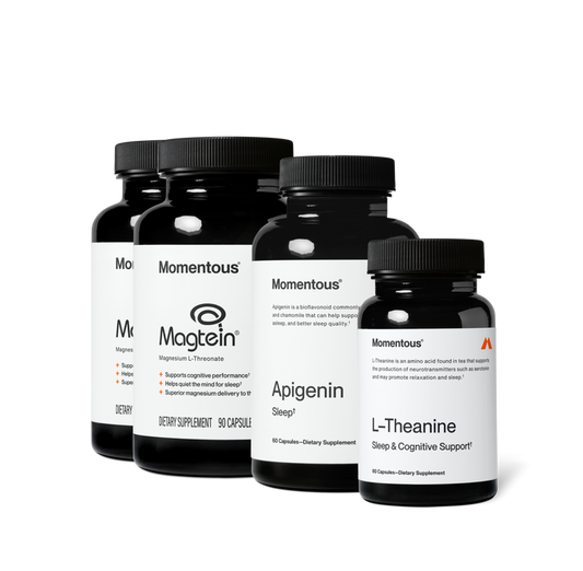 Group product shot of four Momentous dark amber supplement bottles with black caps. Labels read: two "Magtein, Magnesium L-Threonate" bottles with claims "Supports cognitive performance," "Helps quiet the mind for sleep," "Superior magnesium delivery to the brain," 90 Capsules; "Apigenin, Sleep, 60 Capsules"; and "L-Theanine, Sleep & Cognitive Support, 60 Capsules."