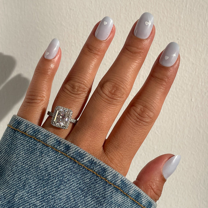 Periwinkle Vampy Heart | Round | Short press on nails in soft periwinkle with white heart details for a fresh mani