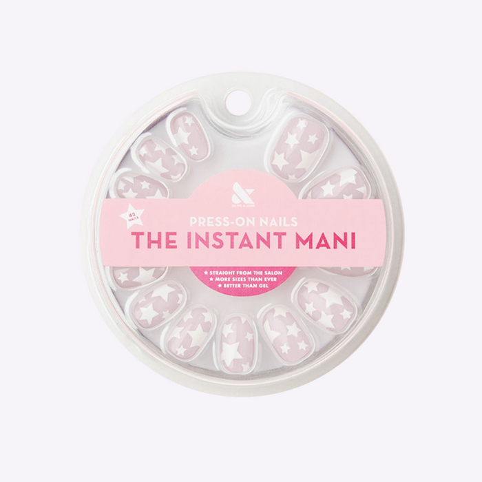 Pink Goldfish Super Stars | Round | Short press-on nails with white star pattern on lavender base for quick mani