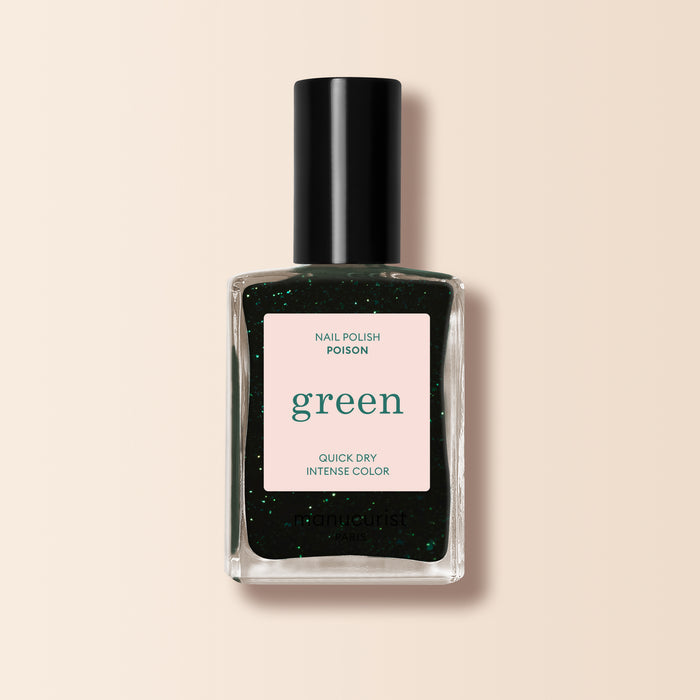 A clear, black-capped bottle of Manucurist Green™ nail polish in the shade "Poison" with “quick dry intense color” and sparkly green glitter inside, shown against a plain beige background.