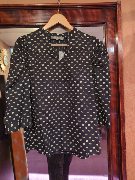 Miss B Presley Bow Top featuring a stylish bow detail, perfect for casual or dressy occasions, in a trendy tops design.