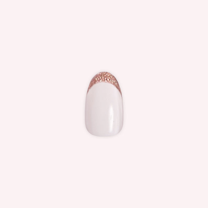 Rose Glitter French | Oval | Medium press-on nail with shimmering rose gold glitter tips and a classic white base for an elegant mani