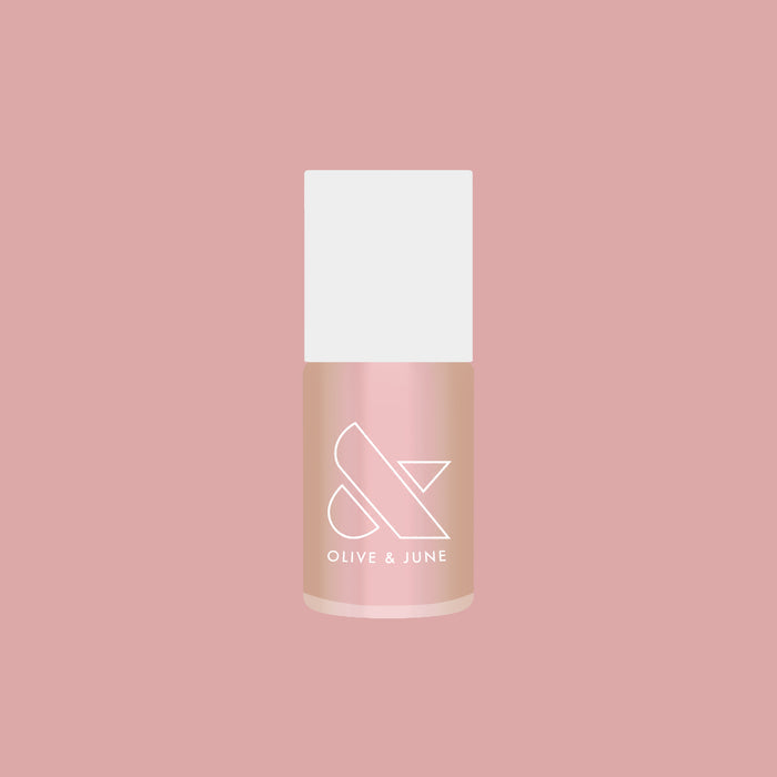 Olive and June Sandy Scallop gel polish bottle showing a creamy milky golden iridescent quick dry polish