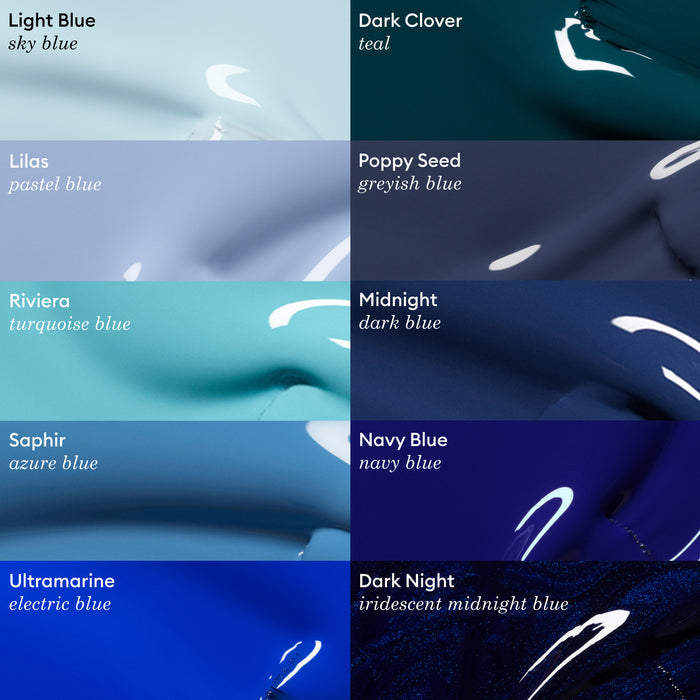A grid of jewel-toned Manucurist nail polish swatches in blue shades, each labeled: Light Blue, Lilas, Riviera, Saphir, Ultramarine, Dark Clover, Poppy Seed, Midnight, Navy Blue, and Dark Night.