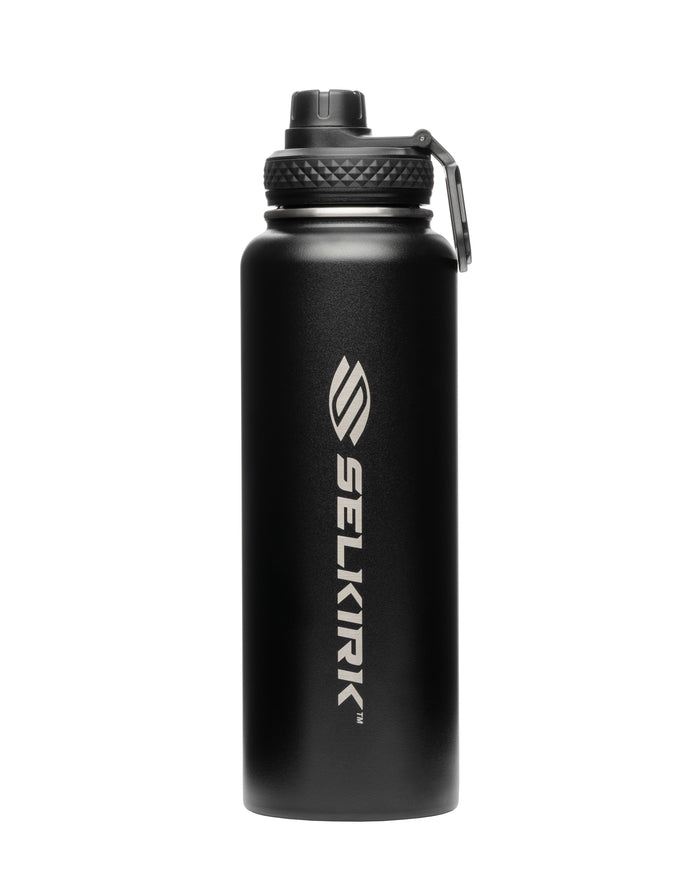 Black insulated metal water bottle with vertical SELKIRK TM logo and screw-top lid with carrying handle.