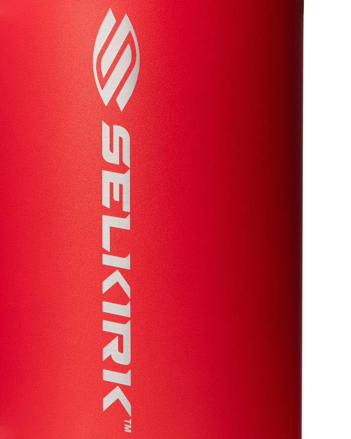 Close-up of red 40 oz Selkirk Sport Premium Pickleball Water Bottle with vertical SELKIRK logo on red finish