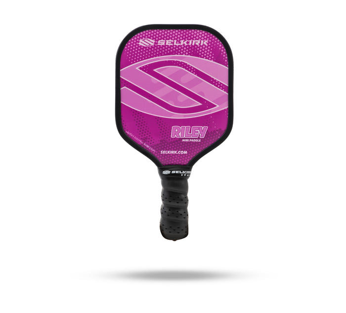 Pink-purple SELKIRK RILEY MINI PADDLE with SELKIRK logo and SELKIRK.COM on the face