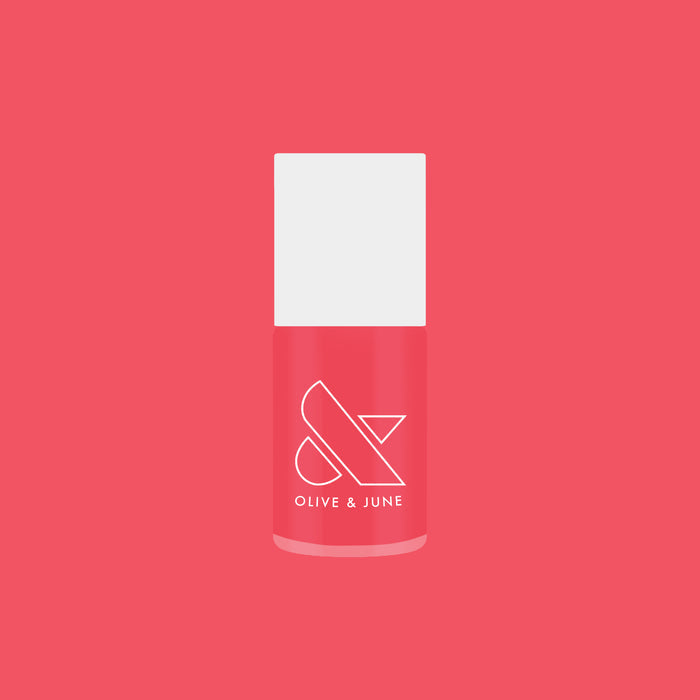 Bottle of Strawberries Are in Season Right Now gel polish by Olive and June in a jelly sheer crimson pink shade