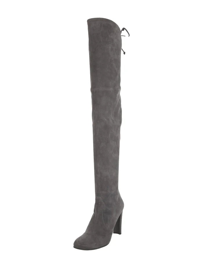 Stuart Weitzman suede boots in size 9, featuring a sleek design and tall heel, displayed on a neutral background.