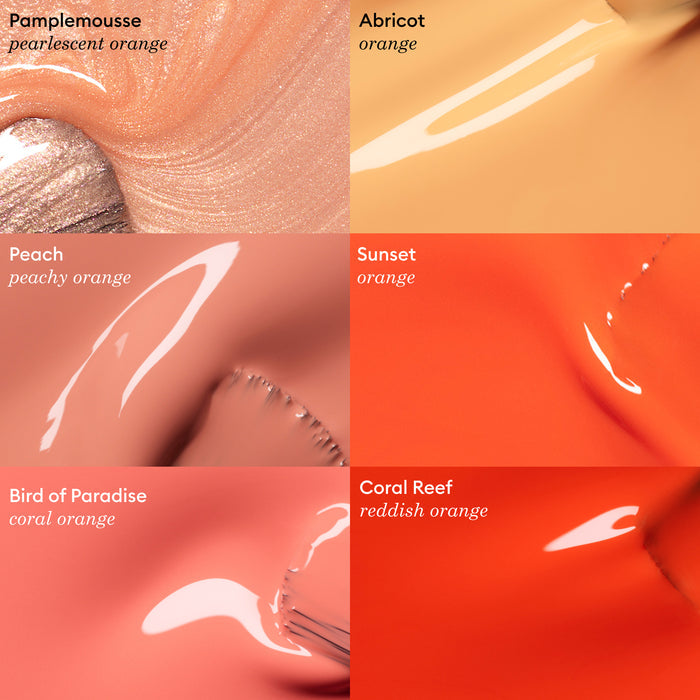 A vibrant orange "Sunset" nail polish swatch from Manucurist's Green™ range displays a stunning hue, part of a collection spanning pearlescent to coral and reddish-orange shades.