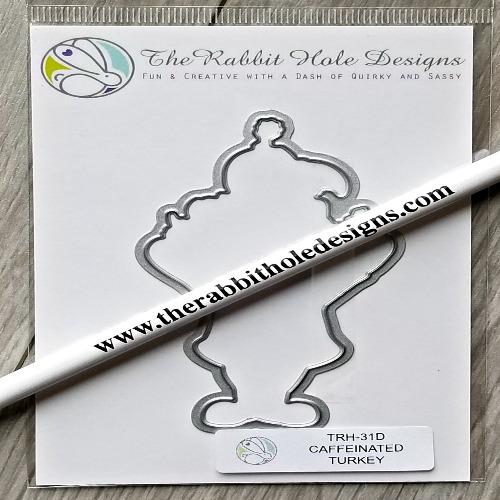 The Rabbit Hole Designs - Die - Caffeinated - Turkey. The Rabbit Hole Designs dies are made of durable 100% steel. Usable in nearly every machine on the market! Use on cardstock, felt, fabric or shrink plastic. You can use wafer thin dies to cut, stencil, emboss and create! Available at Embellish Away located in Bowmanville Ontario Canada.