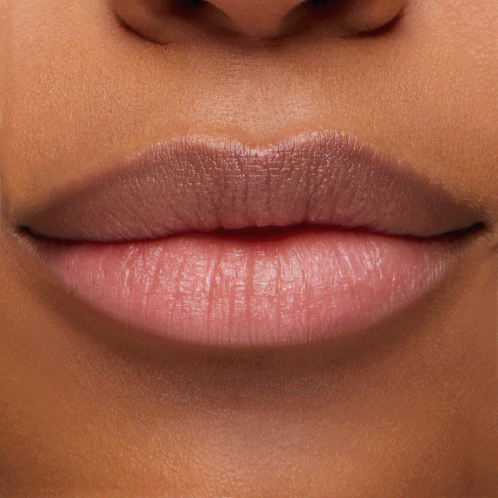 Hydrated lips wearing Thunderbolt, a ColourPop pH Lip Balm, showing a rosy pink, color‑adapting tint with a dewy sheen in a tight studio close‑up, highlighting smooth texture and a natural finish.