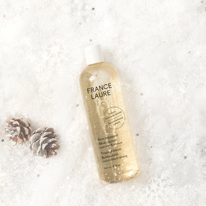 France Laure Tropical Dream Bubble Bath with natural botanical extracts, moisturizing & relaxing, 500ml, on snowy winter background with pinecones