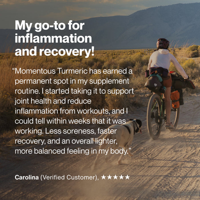 A person rides a bike on a dirt trail with a dog running alongside in a wide open landscape. Text on the image reads: “My go-to for inflammation and recovery!” “Momentous Turmeric has earned a permanent spot in my supplement routine. I started taking it to support joint health and reduce inflammation from workouts, and I could tell within weeks that it was working. Less soreness, faster recovery, and an overall lighter, more balanced feeling in my body.” “Carolina (Verified Customer), ★★★★★”