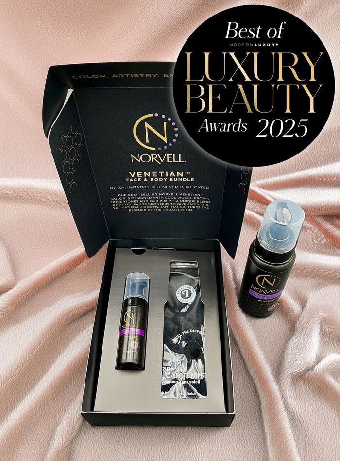 A gift set from Venetian, including a bottle labeled 'Venetian Mousse' and a spray bottle, displayed in an open box with a black interior. The packaging is elegant, featuring gold and white colors, and includes the text 'Best of Luxury Beauty Awards 2025'.