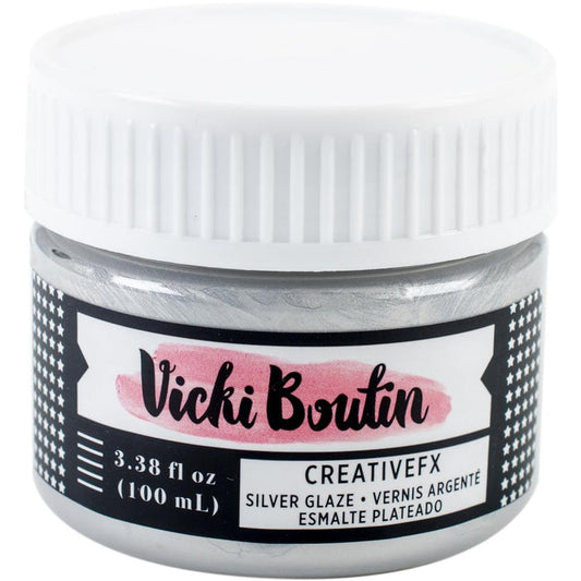 American Crafts - Vicki Boutin - Mixed Media Creative FX Glaze - 3.38oz - Silver. Create impressive glossy layering. May be mixed with paint to produce vibrant, metallic color. Great for papercrafts and more. This package contains 3.38oz of glaze. Acid free. Imported. Available at Embellish Away located in Bowmanville Ontario Canada.