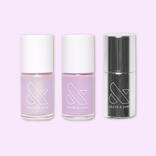 Violet Bliss nail polish set by Olive and June with lavender shades and super glossy top coat for at-home mani.